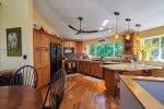 The warm, inviting and open kitchen space will make it easy for guests to visit and cook at the same time.